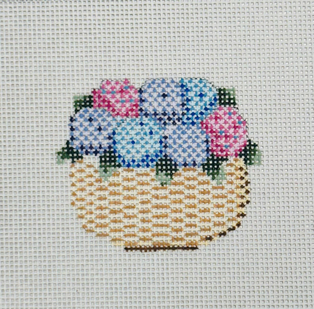 NANTUCKET BASKET WITH PINK AND BLUE HYDRANGEAS